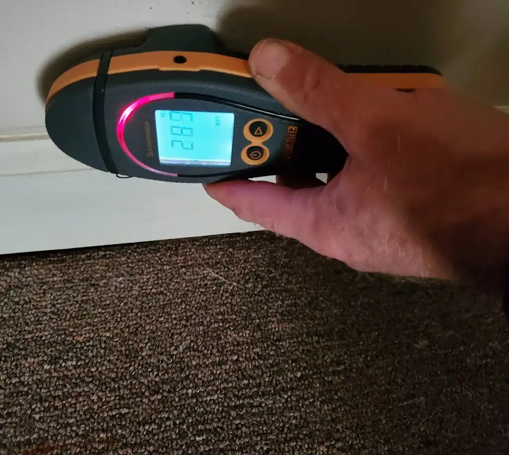 Moisture detection at baseboard during Storm Damage Restoration in North Port